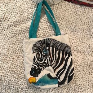 Beautiful hand painted tote on white canvas by artist Julia Pinkham